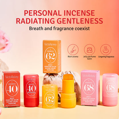 Victoria Key personal incense balm set with red, yellow, and pink sticks and boxes, displayed with promotional text and icons on a peach gradient background.